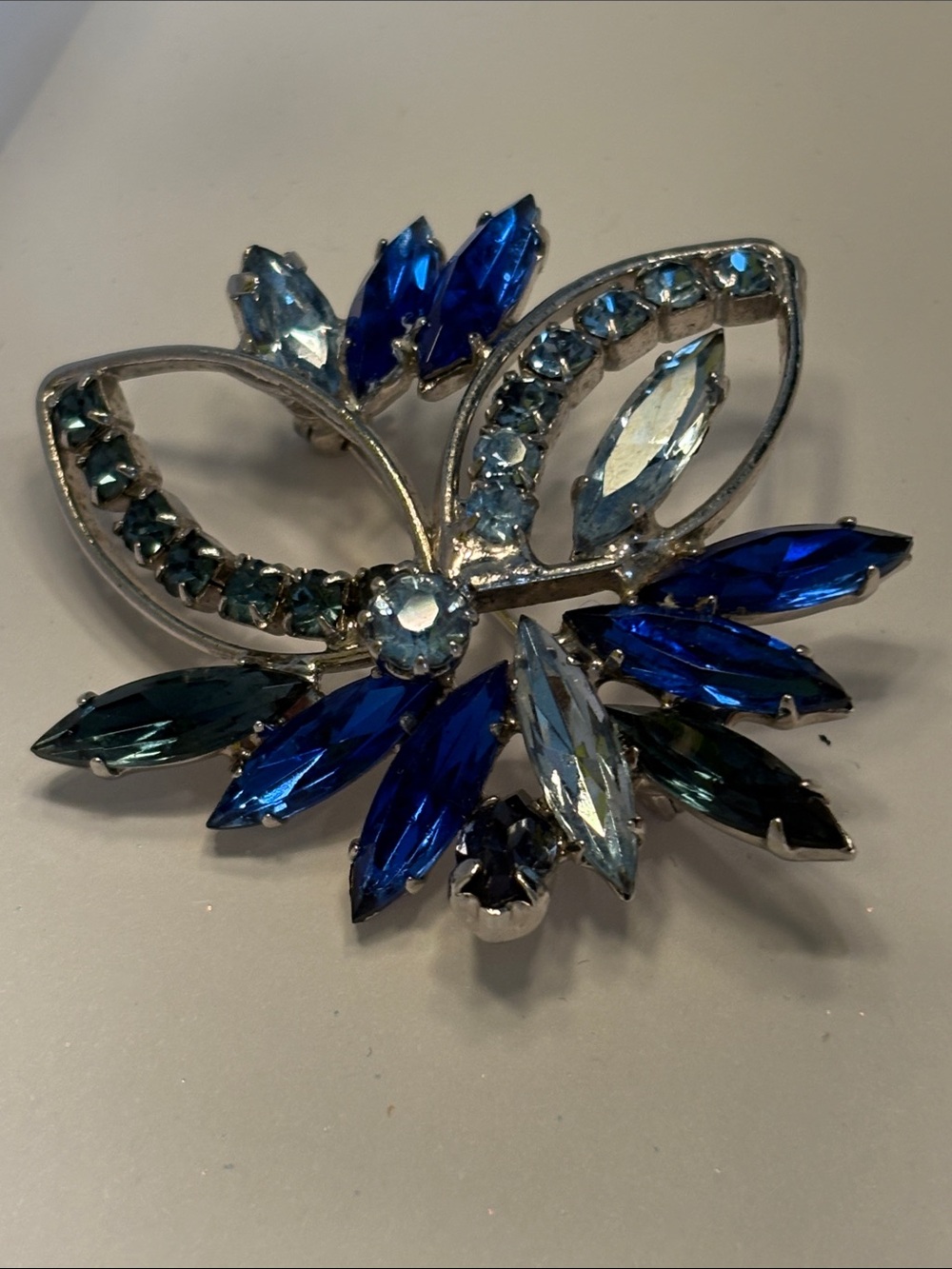Vintage blue rhinestone, floral brooch Silvertone